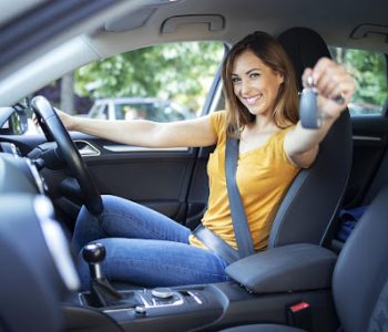 Rent to Own vs Car Subscription — a smiling young woman holding a car key while choosing between a rent-to-own car plan and a car subscription