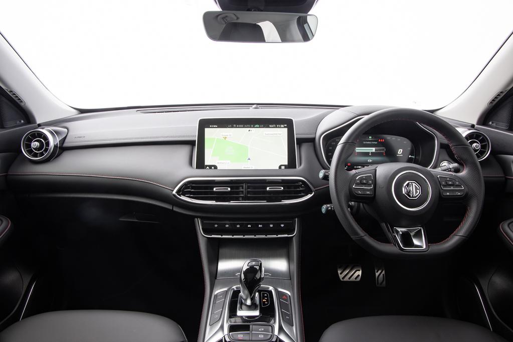 Interior view of MG HS dashboard showing infotainment and steering wheel