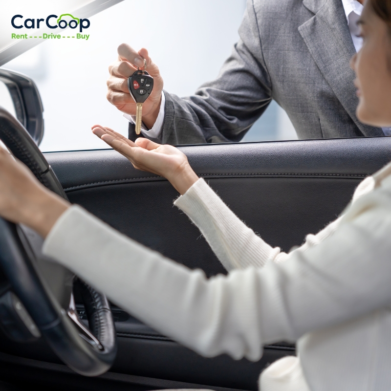 Customer receiving car keys through a rent to own car in Melbourne vehicle handover process