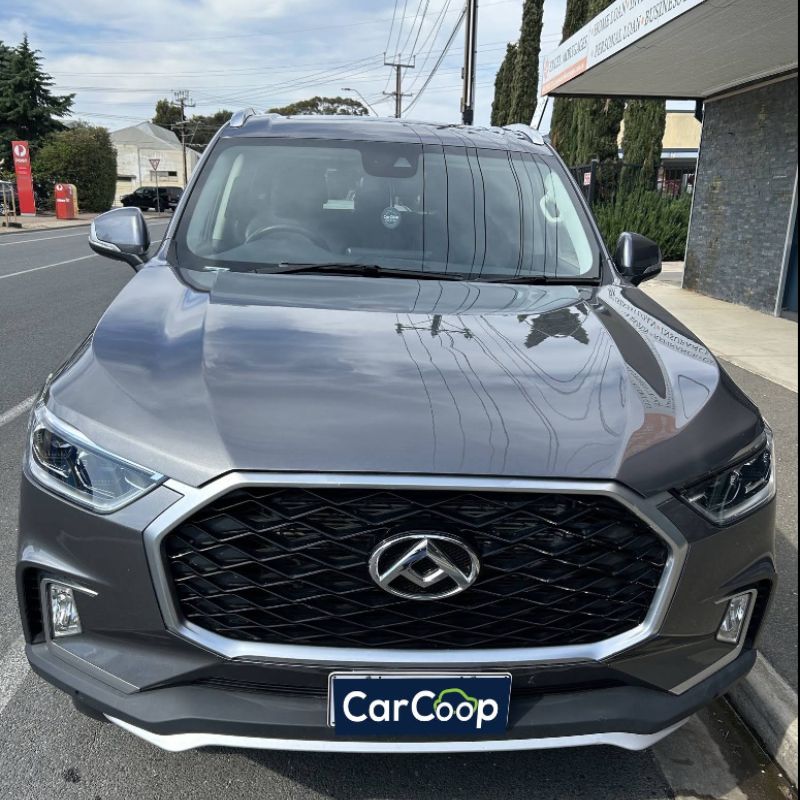 Car Leasing in Australia featuring a grey MG SUV parked outside a dealership